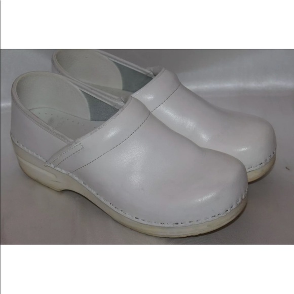 white leather clogs